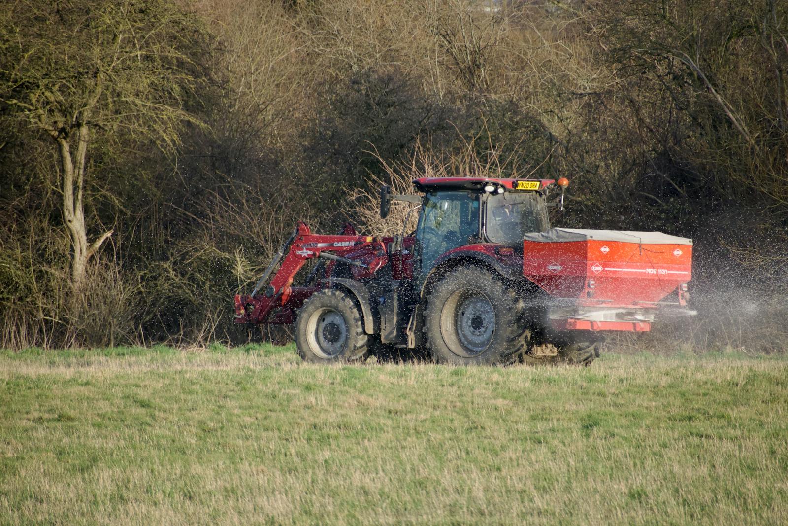 best lawn fertilizer for spring applied with spreader on turf